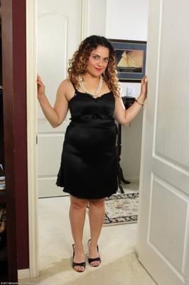 Mature Drew slips out of her black dress.