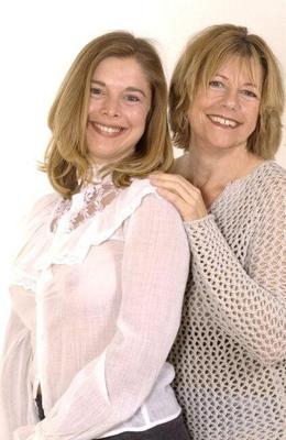 Mom and daughter posing in the studio